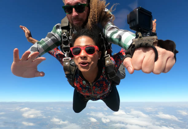 istock Beautiful black woman practicing skydiving. 1356954676