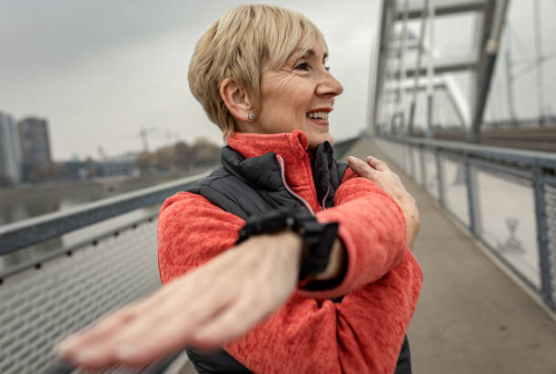 istock Active senior woman stretches her muscles before running. 1356954717
