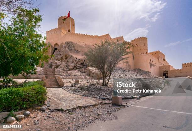 Walls Of Medieval Arabian Military Fortress In Nakhal Oman Hot Day With Haze In The Sky Old Arabian Castle Tall Stone Walls Stock Photo - Download Image Now