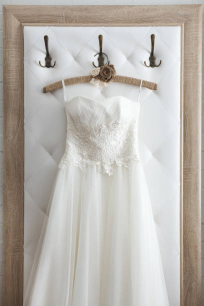 istock White wedding dress on a hanger. 1356958652