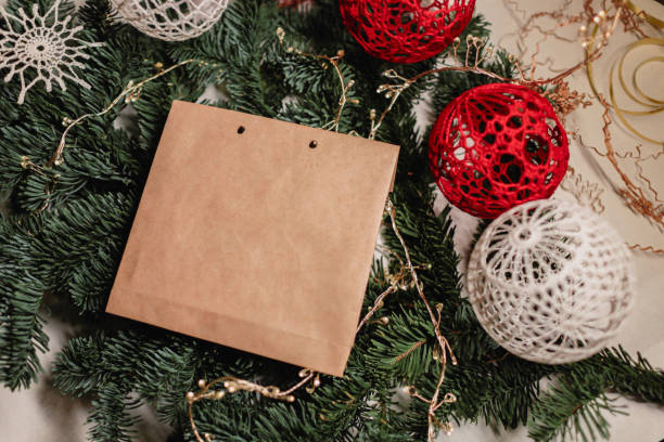 istock Gift wrap, spruce branches and Christmas balls. Christmas gift handmade concept. 1356958778