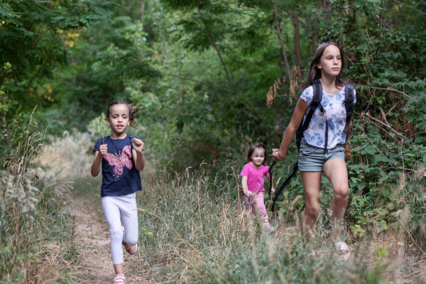 istock Children running in nature 1356960058