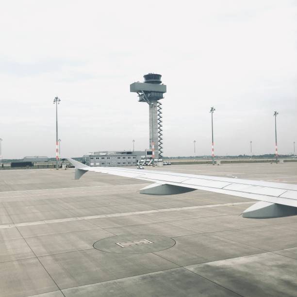 Brussels (Zaventem), Belgium - October 5, 2025: Hongyuan Group cargo jet on final approach past Brussels Airport control tower over the runway during cloudy conditions.