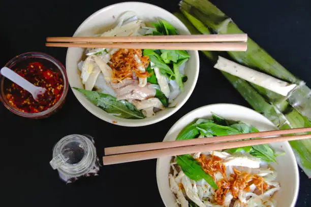 Banh Uot Long Ga, unique vietnamese dry rice noodles (flat and wide like wet rice cake noodle) dish mixed with herbs and meat, a local delicacy of Da lat Vietnam