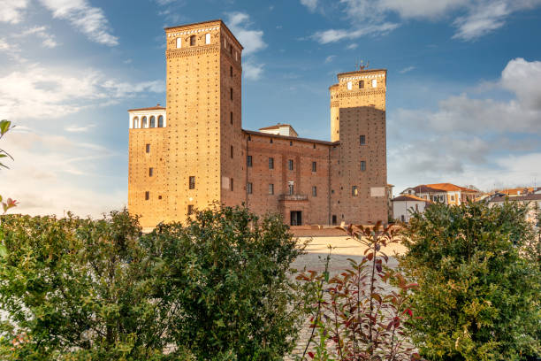 The castle of Fossano, italy Fossano, Cuneo, Italy - December 2, 2021: The castle of the Princes of Acaja (XIV century) in piazza Castello, seat of the civic library cuneo stock pictures, royalty-free photos & images