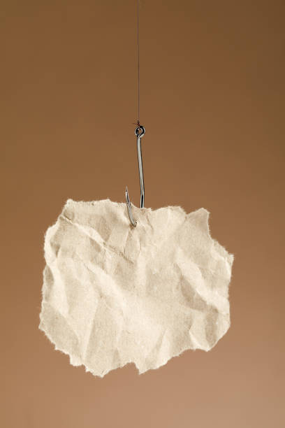 istock blank piece of paper on a fishhook. 1356962488