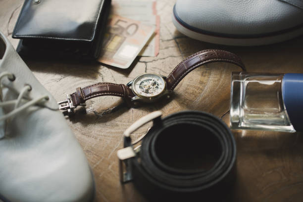 istock Accessories men on a wooden table 1356964773