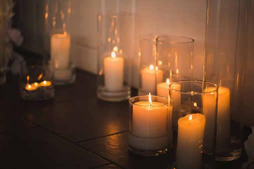 vases with candles stand for wedding ceremony