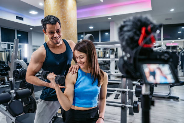istock Two People Filming A Workout At The Gym 1356965931