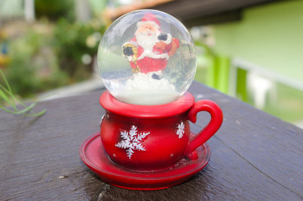 istock Santa Claus inside a glass globe 1356965994
