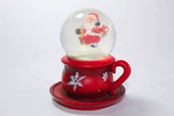 istock Santa Claus inside a glass globe 1356966001