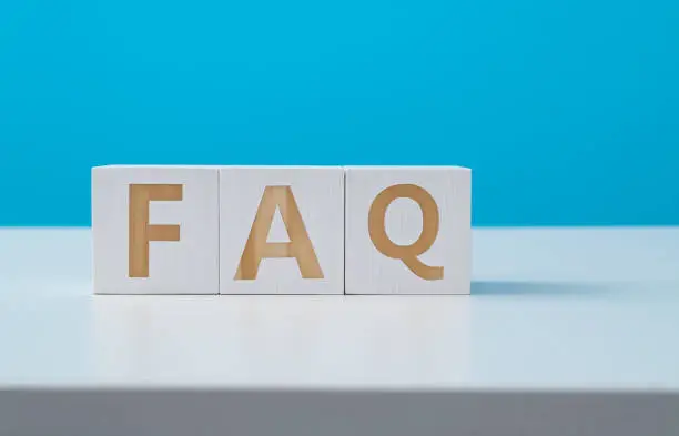 Photo of Wooden blocks with the word FAQ