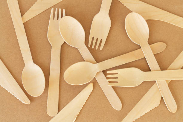 istock Disposable wooden spoon knife and fork top view 1356967761