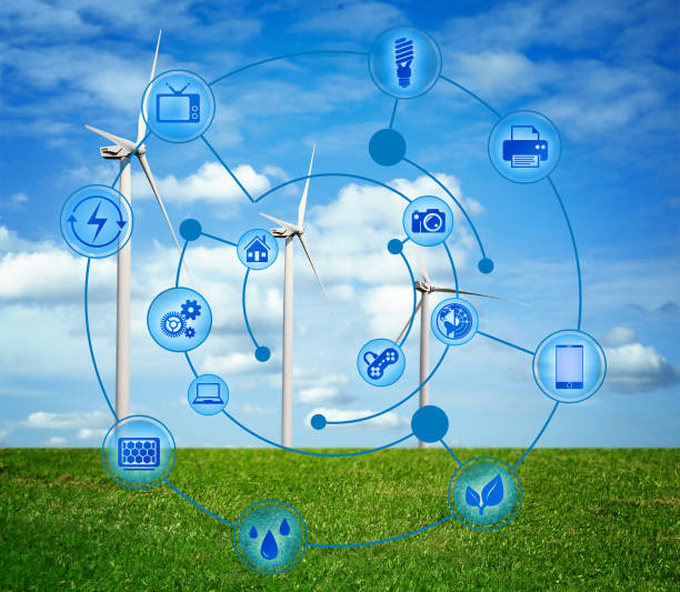 istock Alternative energy source. Wind turbines in field under blue sky and scheme 1356968717