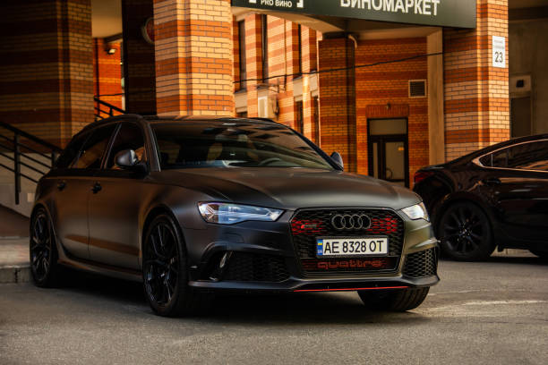 Matte black Audi RS6 car parked in the city stock photo
