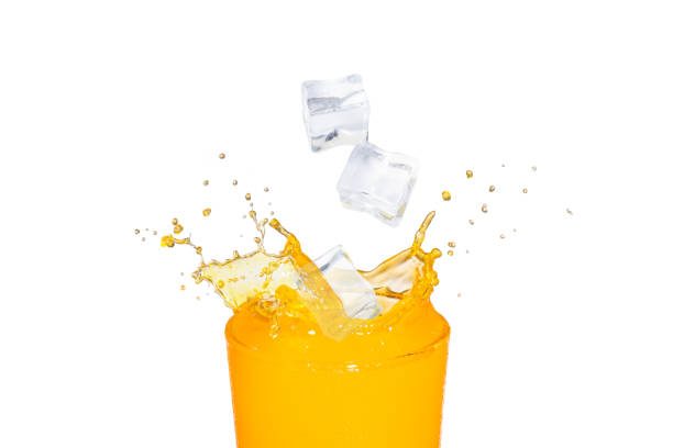 istock orange juice with splash isolated on white 1356969531