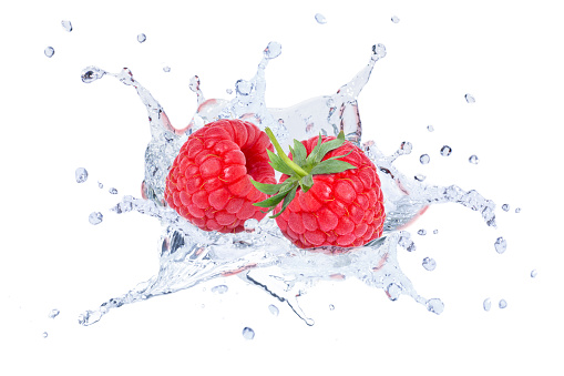 Fresh raspberry in water splash isolated on white background.