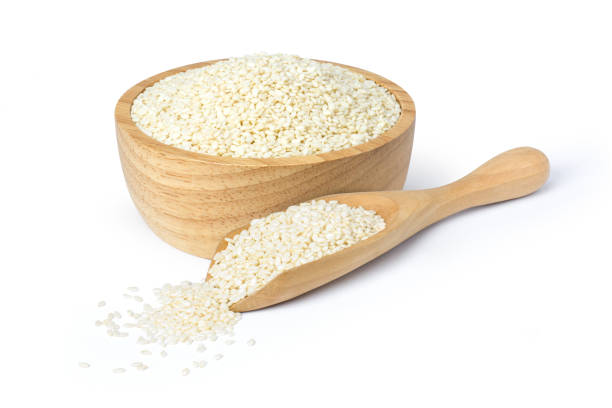 white sesame seeds - sesame seed spoon scoop imagens e fotografias de stock