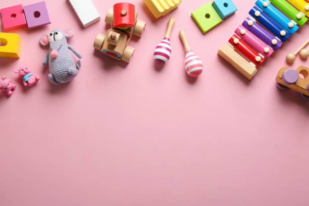 istock Flat lay composition with different toys on pink background. Space for text 1356974519