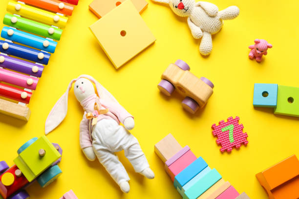 istock Flat lay composition with different toys on yellow background 1356974537
