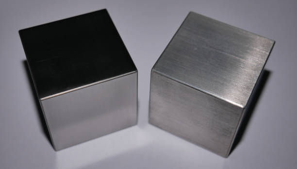 Light and Heavy A tungsten (left) and a magnesium cube. Though they have the sime size, the tungsten cube is 10x heavier! tungsten metal stock pictures, royalty-free photos & images