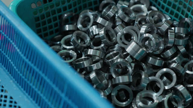 basket tray of iron washers and nuts mixed up  produce form machine in factory
