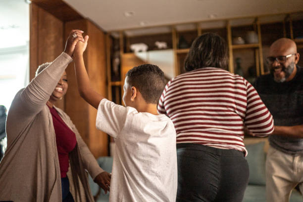 istock Family dancing at home 1356976665