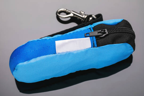 A small blue textile handbag with lightning for fingerboard on a gradient background
