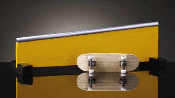 Small fingerboard and railing made of wood on a gradient background