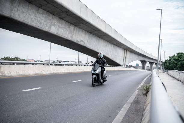 istock Young asian riding a motorcycle 1356977847