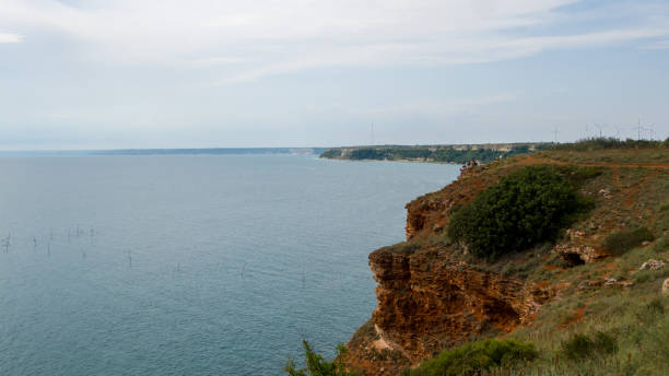 istock Picturesque coastline with steep cliffs 1356978972
