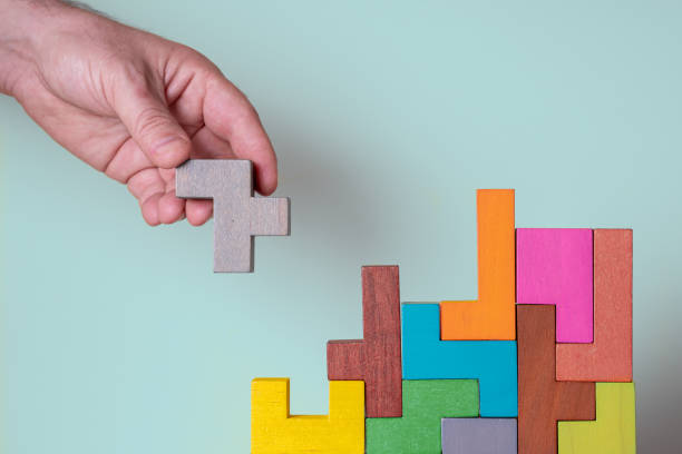 istock Abstract construction from wooden blocks. Concept of decision making process 1356982077