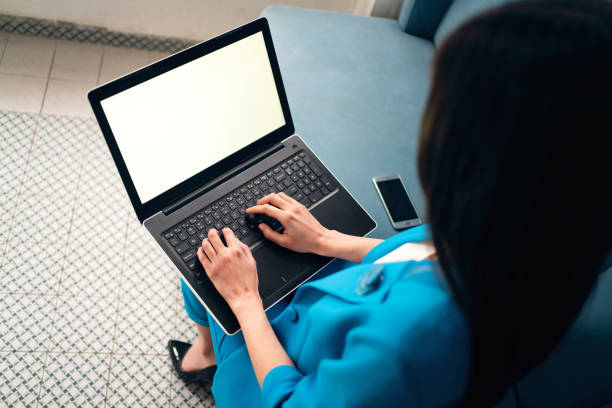 istock Unrecognizable modern businesswoman working on laptop 1356984685