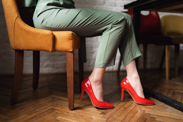 Unrecognizable woman in red high heels Unrecognizable woman wear red high heels high heel shoes stock pictures, royalty-free photos & images