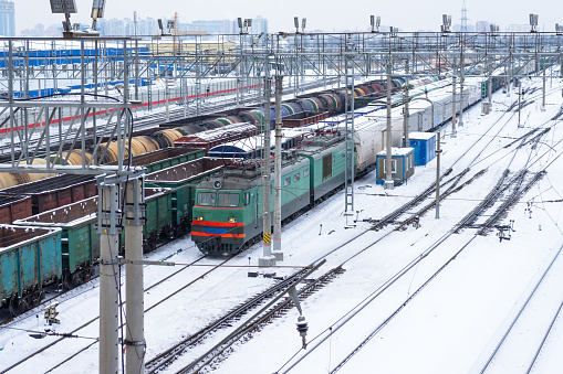 Freight railway station with locomotives in winter