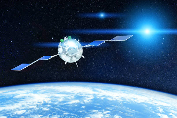 istock Space satellite orbiting the earth and bright stars lights in space. Elements of this image furnished by NASA. 1356988187