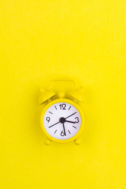 istock A yellow alarm clock on a yellow background is a copy device. An article about time. 1356989186
