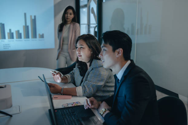 istock LGBTQ business person presenting. 1356991571