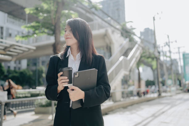 istock Woman business walking. 1356991611
