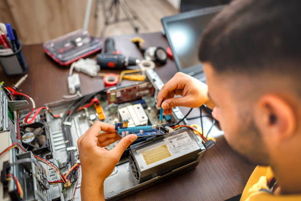 istock Young electrician doing home repair 1356992179