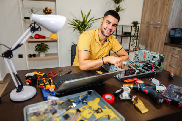 istock Young electrician doing home repair 1356992246