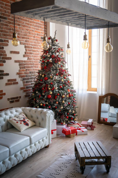 istock Christmas tree with presents underneath in living room 1356993231