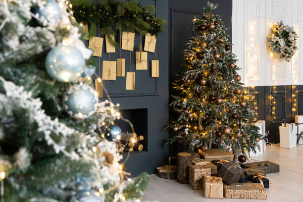istock Beautiful holdiay decorated room with Christmas tree with presents under it 1356993407