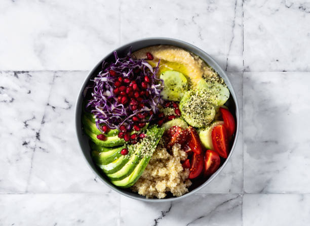 istock vegan buddha bowl with quinoa and hummus on marble table 1356995845