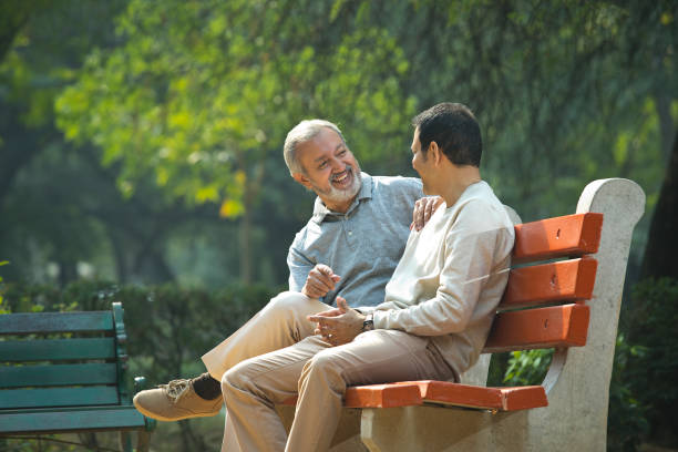 istock Old man spending leisure time with son at park 1356998479