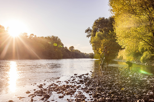 Late afternoon mountain bike ride by the river