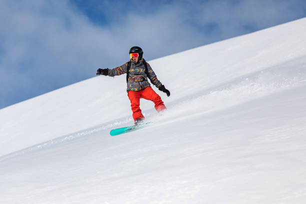 istock Snowboarder in mountains 1356999125