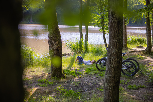 Woman relaxing after riding a bike in the nature