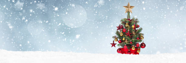 istock Christmas Tree with decoration on a winter background. 1357000296