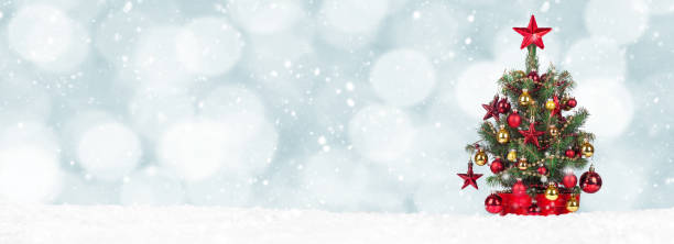 istock Christmas Tree with decoration on a winter background. 1357000300